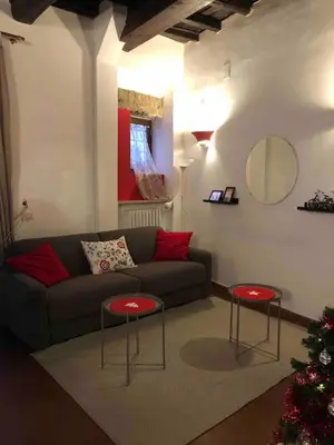 a living room with a couch and two tables at Appartamento Castel Sant'Angelo in Rome