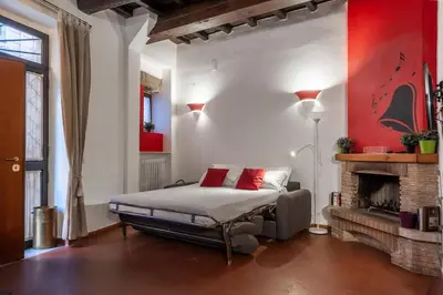 a bedroom with a bed and a fireplace at Appartamento Castel Sant'Angelo in Rome