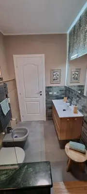a bathroom with a toilet and a tub and a sink at Gloria Mundi in Rome