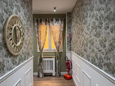 a childs room with decorated walls and a window at Gloria Mundi in Rome