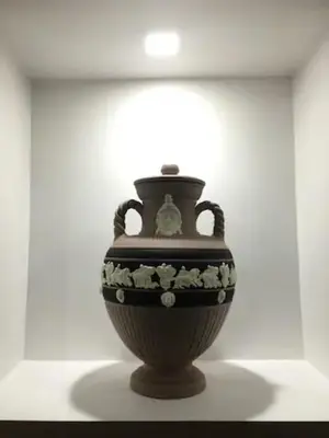 a vase on display in a white room at Sunset Home in Rome