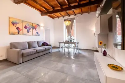 a living room with a couch and a table at Angelina Domus Saint Peter's in Rome
