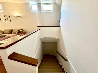 a staircase leading up to a room with a couch at Linda Charme in Rome