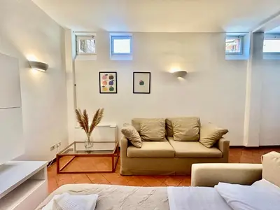 a living room with a couch and a table at Linda Charme in Rome