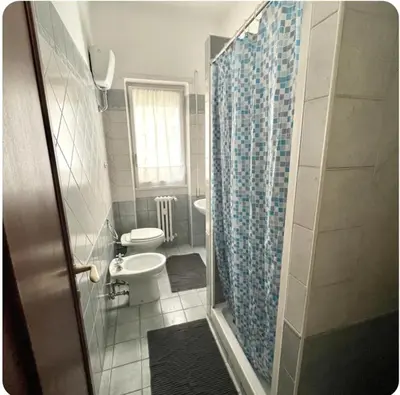 a bathroom with a shower and a toilet and a sink at K-Vatican Apartment in Rome