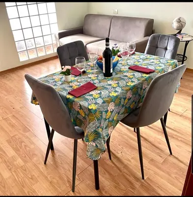 a table with a bottle of wine and glasses on it at K-Vatican Apartment in Rome