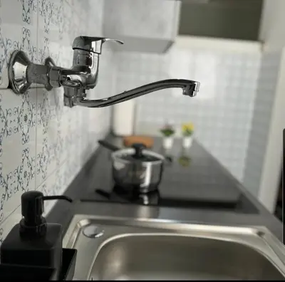a kitchen sink with a faucet next to a counter at K-Vatican Apartment in Rome