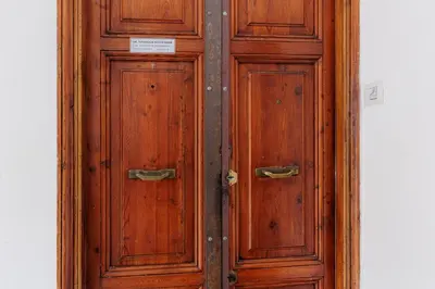 a wooden door with a sign on it at 10 Min Colosseum, PreNestInHome - Renovated 2024 Apartment, P igneto , Self Check-in h24 in Rome
