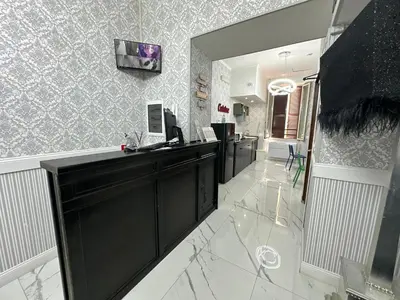 a kitchen with a black counter and a mirror at Jupiter Home in Rome