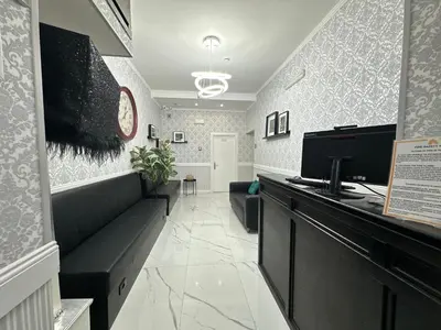 a waiting room with a couch and a counter at Jupiter Home in Rome
