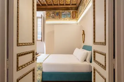 a bedroom with a bed in a room at Casa Paolina, Burghesius homes in Rome