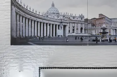 a large building with a fountain in front of it at Vatican Sweet Dreams Apartment in Rome