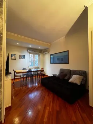a living room with a couch and a table at La casa di Gió in Rome