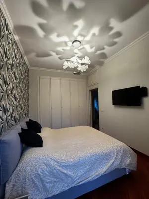 a bedroom with a bed and a ceiling at La casa di Gió in Rome