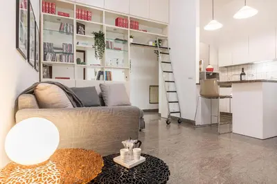 a living room with a couch and a table at Casa Aurora - WelcomeToRhome in Rome