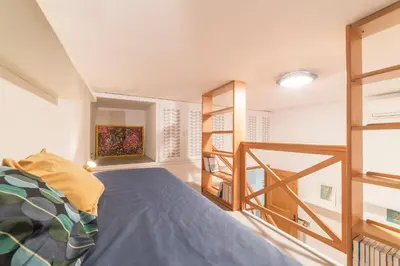 a bedroom with a bed and a book shelf at Casa Aurora - WelcomeToRhome in Rome