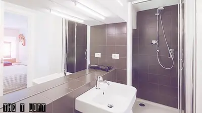 a bathroom with a sink and a shower at Trastevere Loft in Rome