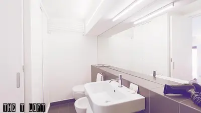 a white bathroom with a sink and a toilet at Trastevere Loft in Rome