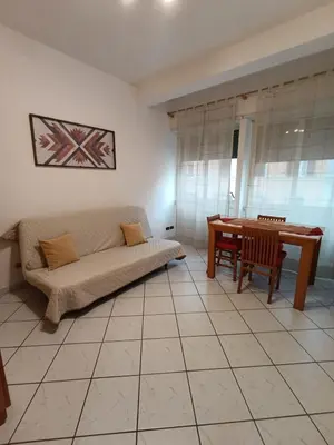 a living room with a couch and a table at San Giovanni Apartment in Rome