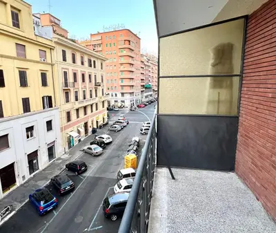 a view of a city street with cars parked at San Giovanni Apartment in Rome