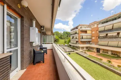 an apartment balcony with a view of a courtyard at Pica's House in Rome