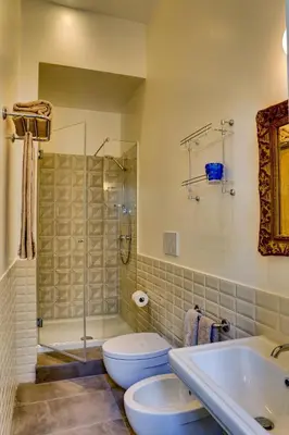 a bathroom with a toilet and a shower and a sink at Casa Sotgiu Guest House in Rome