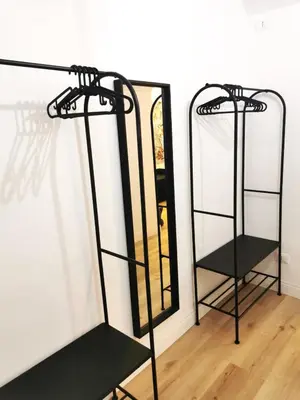 a dressing room with a mirror and a shelf at Casa D'Agata in Rome