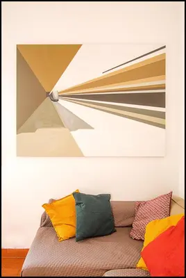a couch with colorful pillows in a room at Casa di Cosimo - WelcomeToRhome in Rome