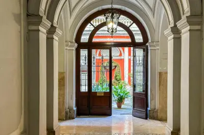 an entrance to a building with a large wooden door at La Finestra sulla Basilica in Rome