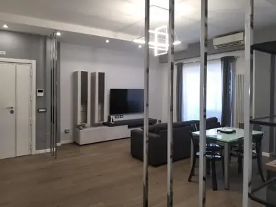 a living room with a couch and a table at Patrica house in Rome