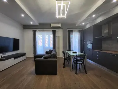 a living room with a couch and a table at Patrica house in Rome