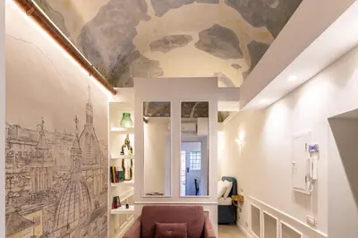 a living room with a painting on the ceiling at NOH Forum Patio in Rome