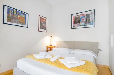 a bedroom with a bed with two towels on it at Boutique Caravaggio in Rome