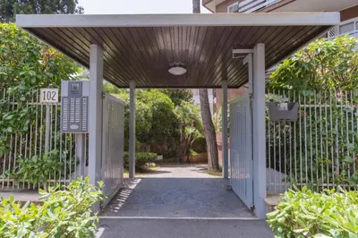an entrance to a house with a blue gate at Boutique Caravaggio in Rome