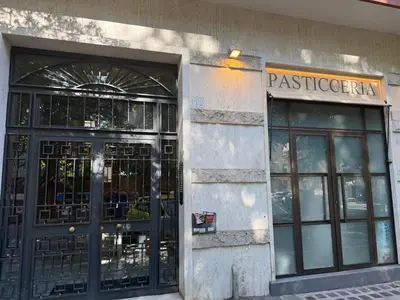 a building with two doors and a sign on it at Sunflower House in Rome