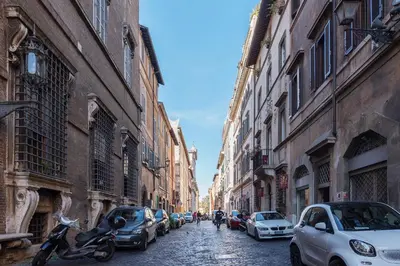 a city street with cars parked on the sides of buildings at Casa Giulia - WelcomeToRhome in Rome