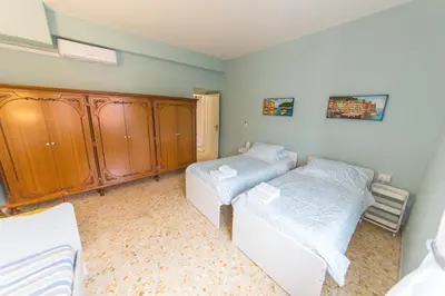 a bedroom with two twin beds and a bedvisor at raffaele affittacamere guesthouse in Rome