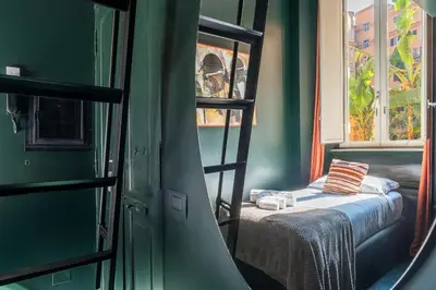 a bedroom with a bunk bed and a window at GuestHost - San Pietro Studio Apartment Roma in Rome
