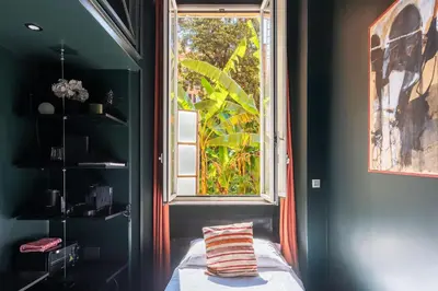 a bedroom with a window and a bed with a pillow at GuestHost - San Pietro Studio Apartment Roma in Rome