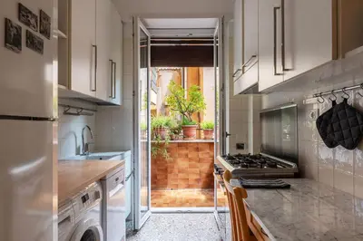 a kitchen with a sink and a stove at Casa Luisa - WelcomeToRhome in Rome