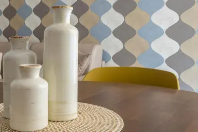 three white vases sitting on top of a table at Vacanze romane - Domus chic Trastevere - Marconi by Hôtea in Rome