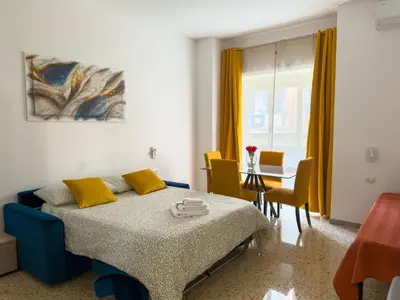 a bedroom with a bed and a table and chairs at King Vatican Suite in Rome