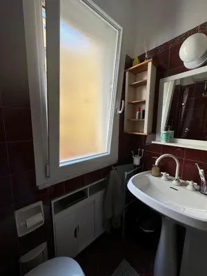 a bathroom with a sink and a window at Appartamento Corso Trieste in Rome
