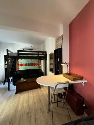 a room with a table and a bed at Appartamento Corso Trieste in Rome