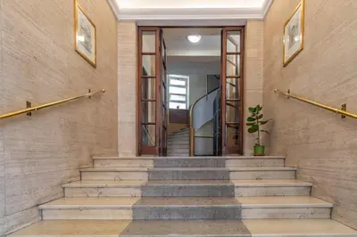 a staircase in a building with a stair case at AureaLiving - Satrico Cozy Apartment fast WIFI and Air Conditioning in Rome