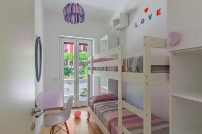 a kids room with bunk beds and a desk at La Buganvillea locazione turistica in Rome