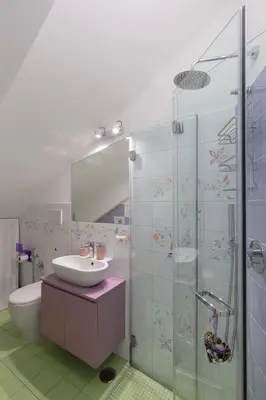 a bathroom with a sink and a shower at La Buganvillea locazione turistica in Rome