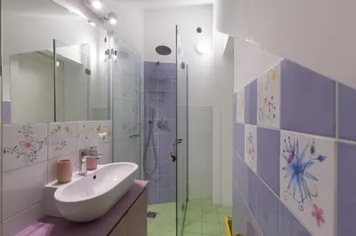 a bathroom with a sink and a shower at La Buganvillea locazione turistica in Rome