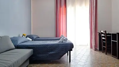 a living room with two blue couches and a couch at Appartamento via Caneva - Tiburtina in Rome