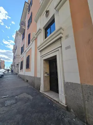 a building with a door on the side of a street at Di Lollo Comfort Suites in Rome